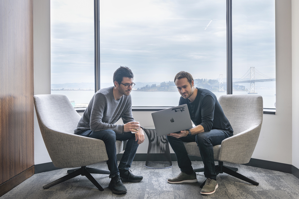 cofounders-working-with-bay-bridge-view